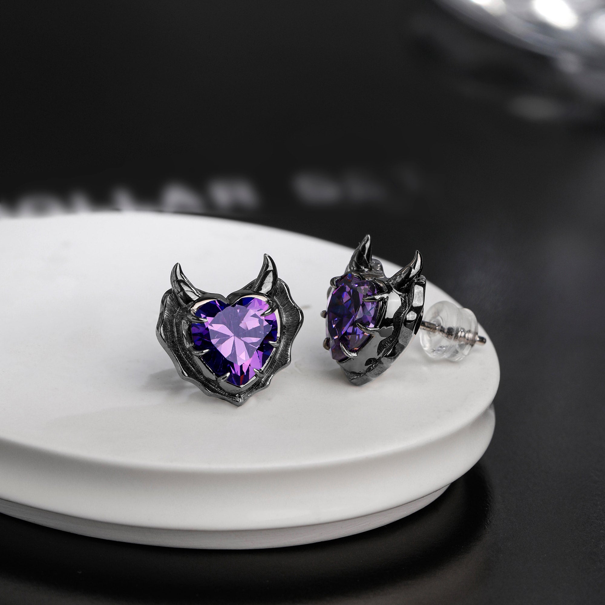 Detail view of Devil Stud Earrings sterling silver stud earrings by PurpleSea