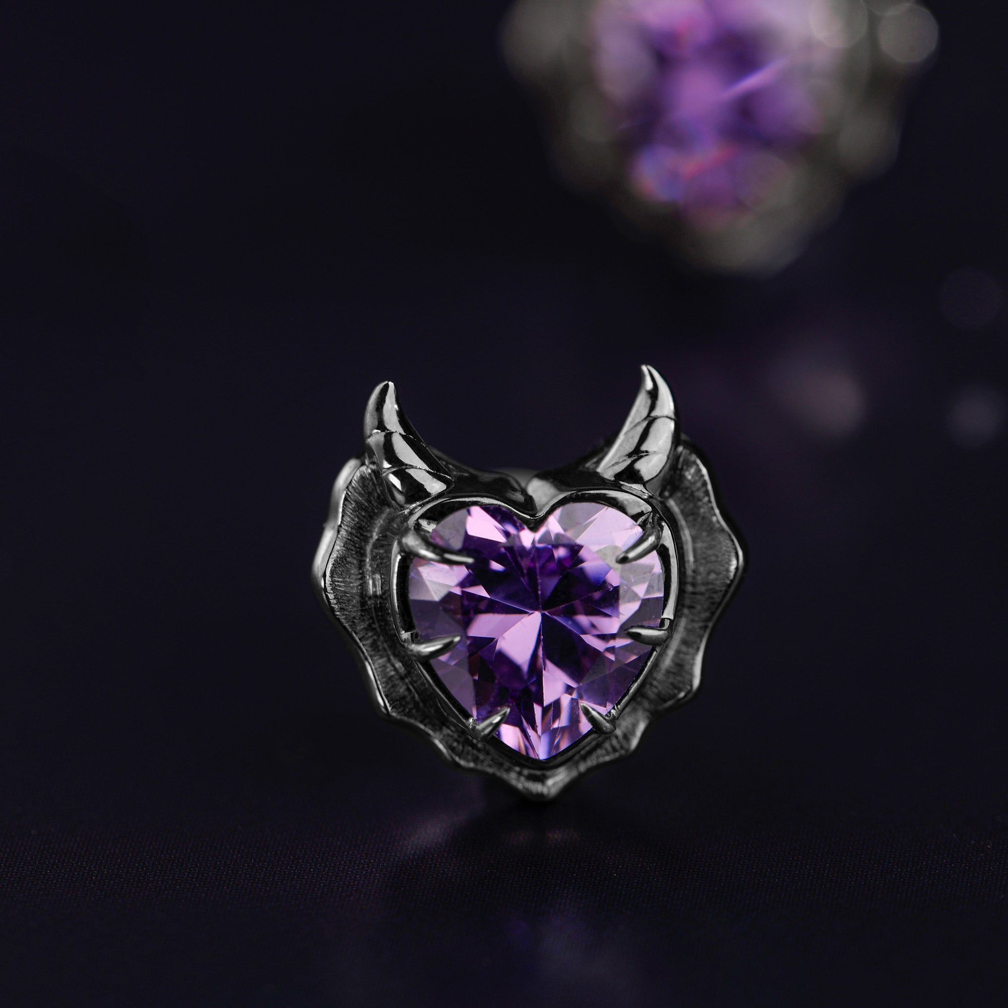 Detail view of Devil Stud Earrings sterling silver stud earrings by PurpleSea