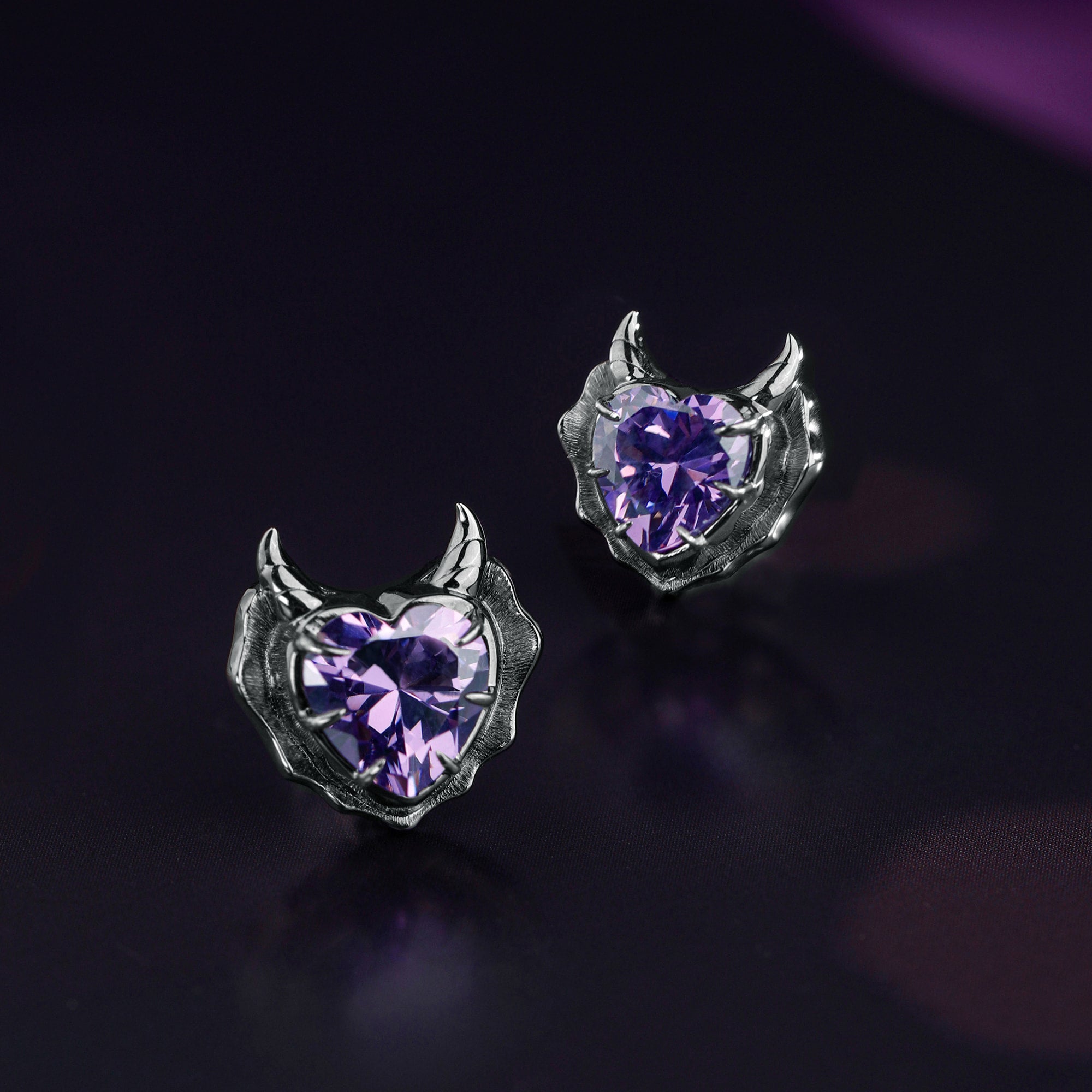 Detail view of Devil Stud Earrings sterling silver stud earrings by PurpleSea