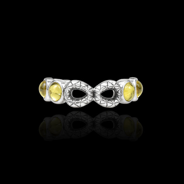 PurpleSea Infinity Ring, sterling silver open ring with repeating infinity motifs, clear stones and pale yellow accent stones, front product view on a black background