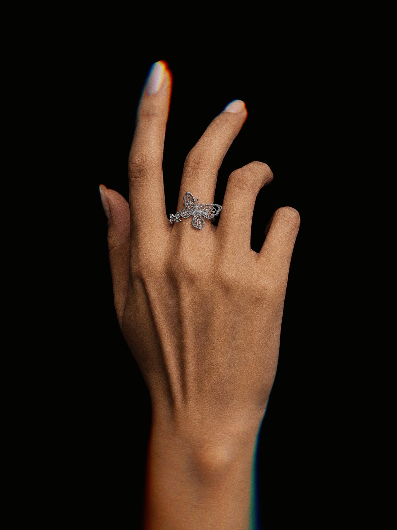 PurpleSea Butterfly Ring, sterling silver open ring with a detailed butterfly motif and pavé-style wings, shown worn on a model's hand