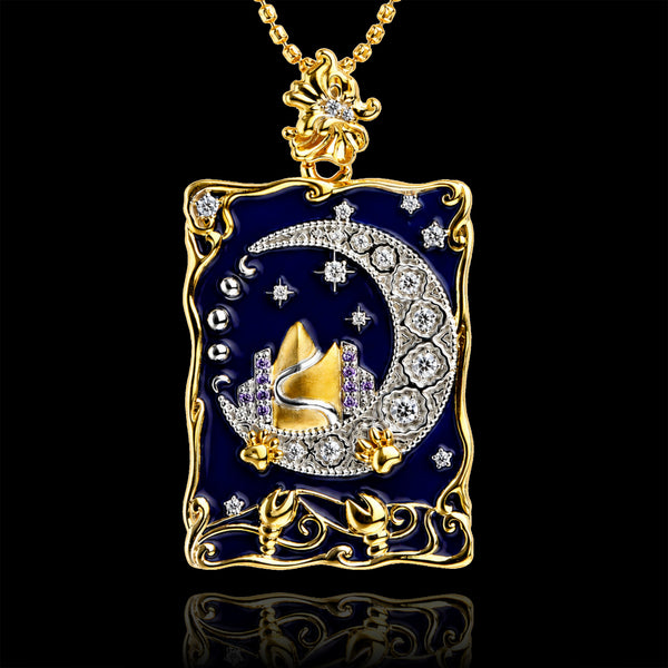 PurpleSea The Moon Tarot Pendant, gold-tone rectangular pendant with deep blue enamel, a crescent moon and starry details, front view on a black background